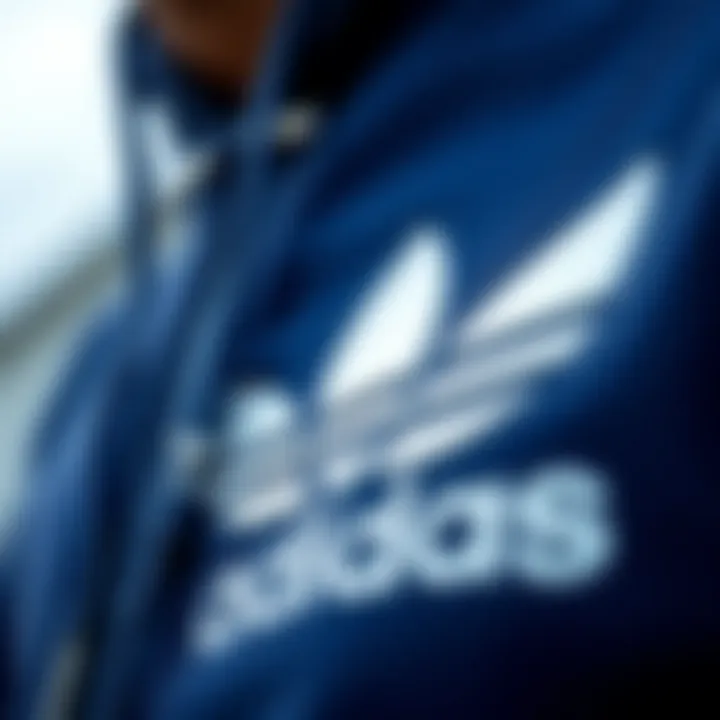 Close-up of the iconic Adidas trefoil logo representing its cultural significance