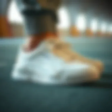 Close-up of white Puma shoes showcasing unique design elements