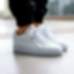Stylish white Puma sneakers on a minimalistic background