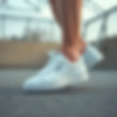 Athletic individual wearing white Puma sneakers during a workout