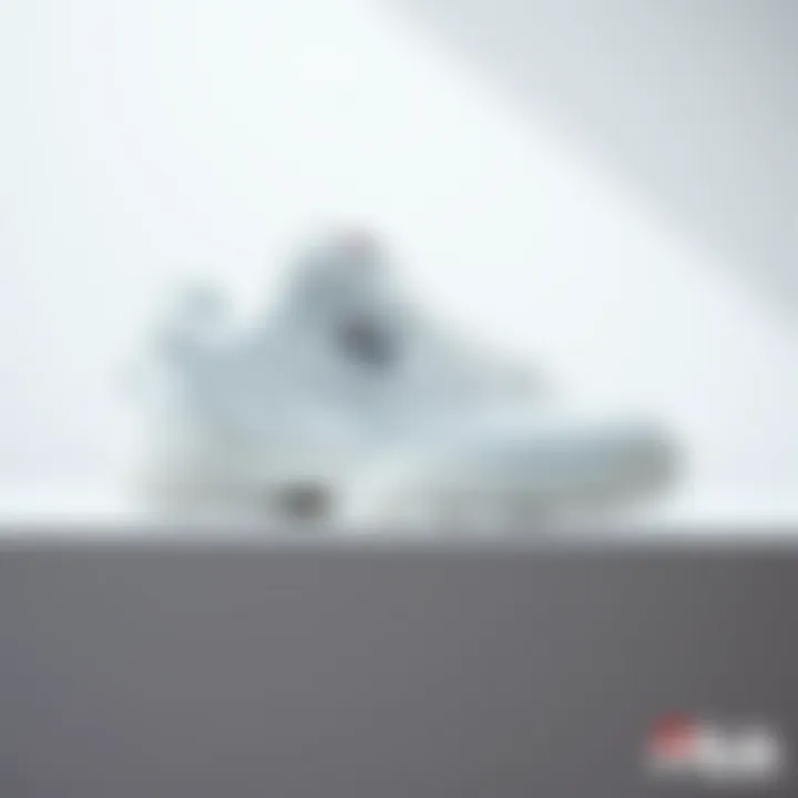 Stylish Fila white sneakers showcased on a minimalist background