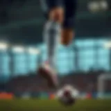 Dynamic action shot of a football player showcasing long socks during a match.