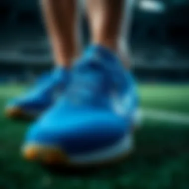 A close-up view of the blue artificial turf shoes showcasing their intricate design.