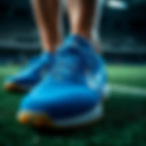 A close-up view of the blue artificial turf shoes showcasing their intricate design.