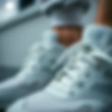 A close-up view of New Balance white shoes showcasing design details and craftsmanship.