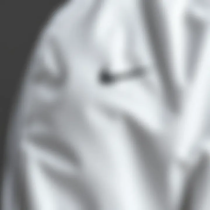 Close-up of the fabric texture of a white Nike jacket