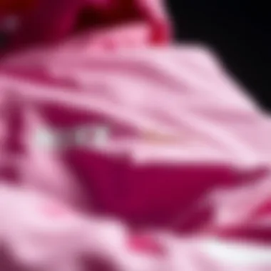 Close-up of the fabric and design details of the pink Nike jacket