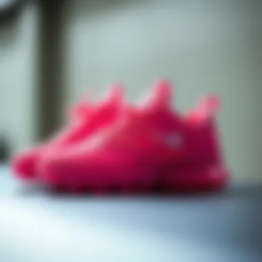 Stylish Pink Nike Sneakers A pair of stylish pink Nike sneakers positioned elegantly on a sleek surface