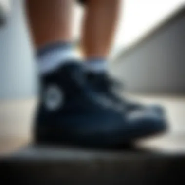 Stylish outfit featuring black high-top Converse in a casual setting