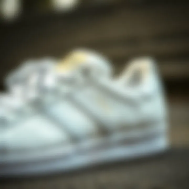 Close-up of Adidas Superstar white sneakers showcasing intricate design details