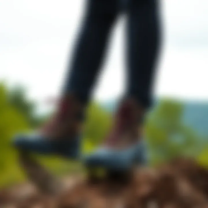 Water-resistant boots paired with casual sportswear in a natural environment.